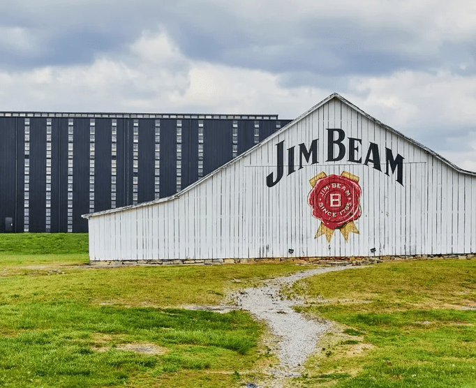 A barn with the name jim beam painted on it.