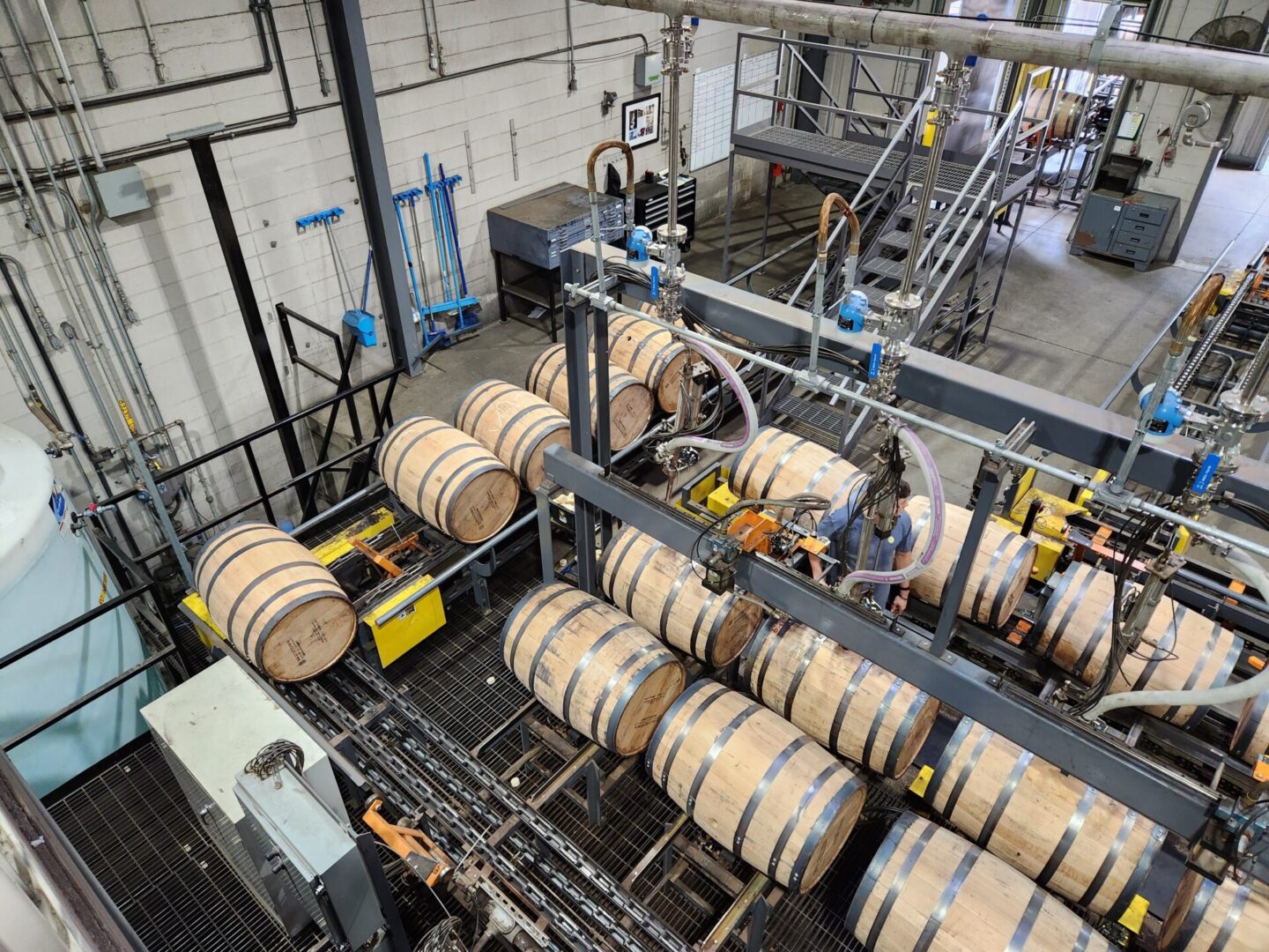 A large warehouse filled with barrels of wine.