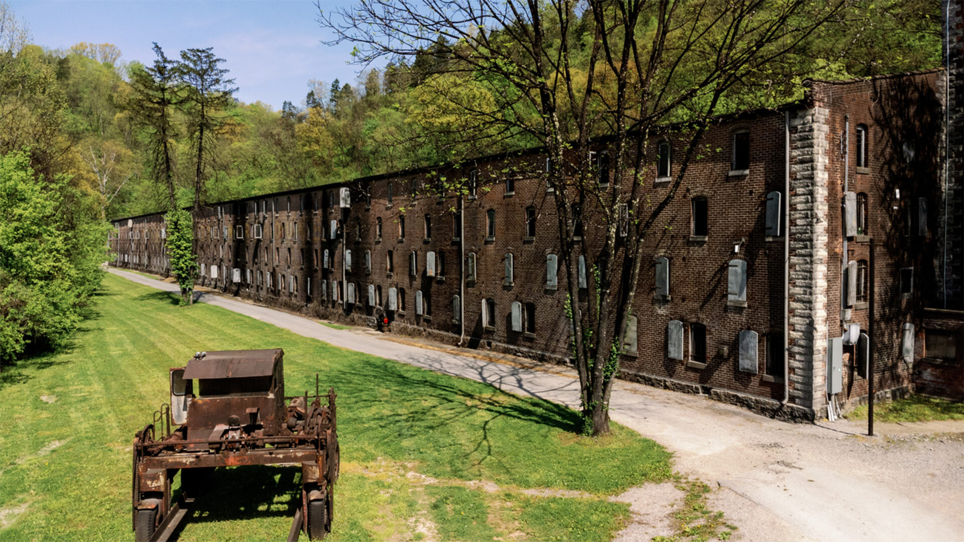 A long row of buildings on the side of a road.