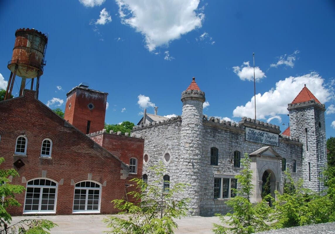 A castle like building with a red brick roof.